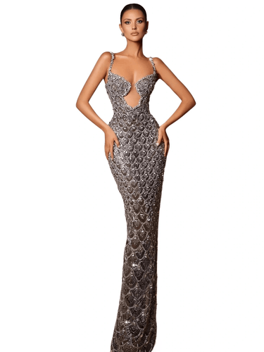 Silver evening gown with intricate detailing on a model against a white background.